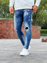 レッドペイントデニムパンツ