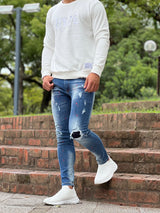 レッドペイントデニムパンツ