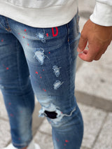 レッドペイントデニムパンツ