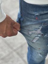 レッドペイントデニムパンツ