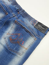 レッドペイントデニムパンツ