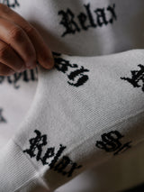 英字総柄ニット